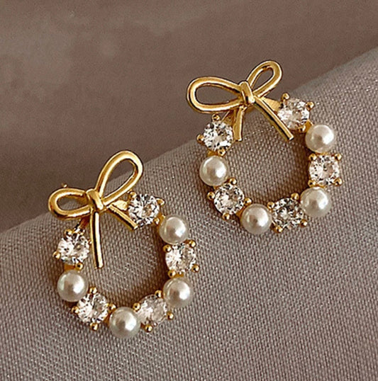 PENDIENTES LAZO PERLAS AC.INOX.