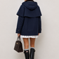 CHAQUETA CON CAPA Y CAPUCHA