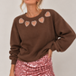 SUDADERA ABERTURAS CORAZONES